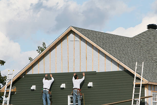 Professional Siding technician working in Woodland, PA